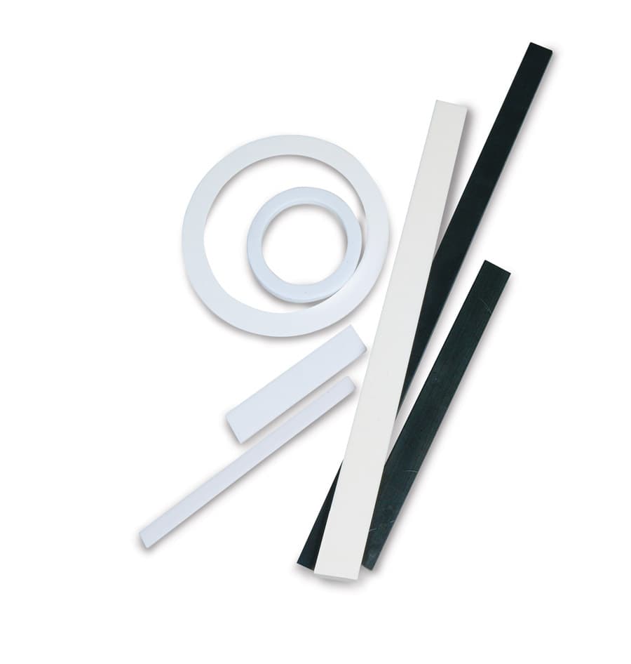 Raw piezoelectric ceramic elements in various forms: rings, bars, and strips before assembly into motor stators