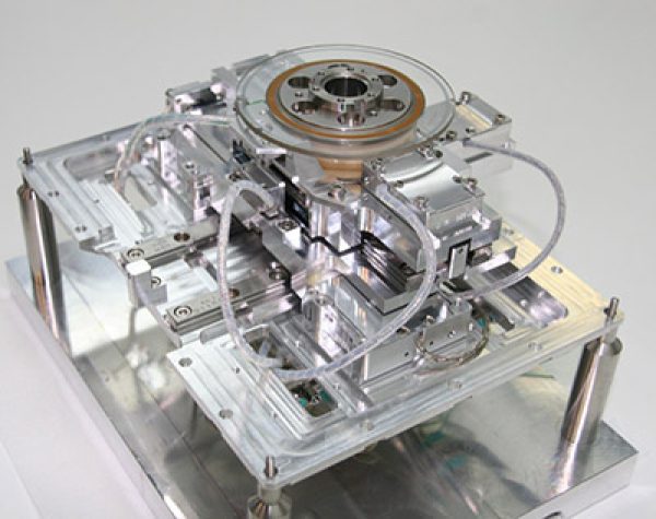 Electron beam stage assembly for magnetically sensitive applications