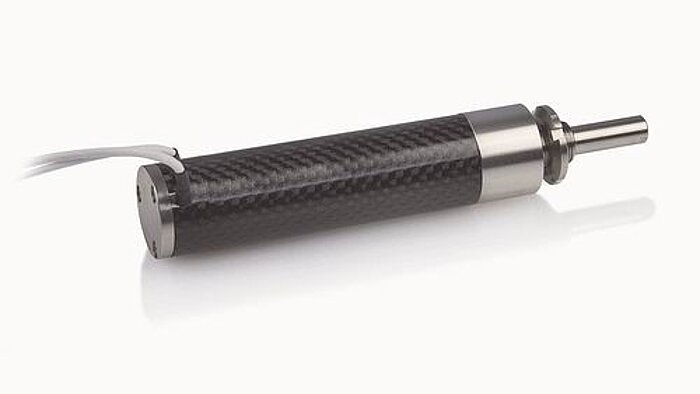 NEXACT non-magnetic piezoelectric linear actuator with carbon-fiber housing for MRI compatibility