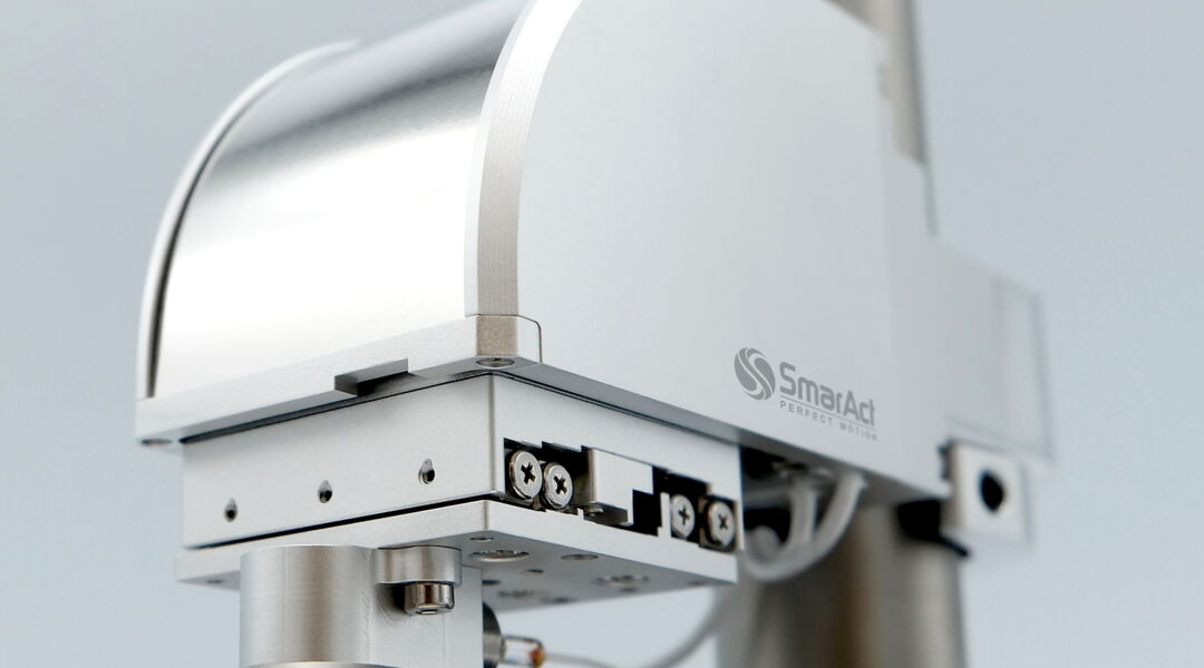 SmarAct 3D positioning stage with sensor payload mounted above the stage