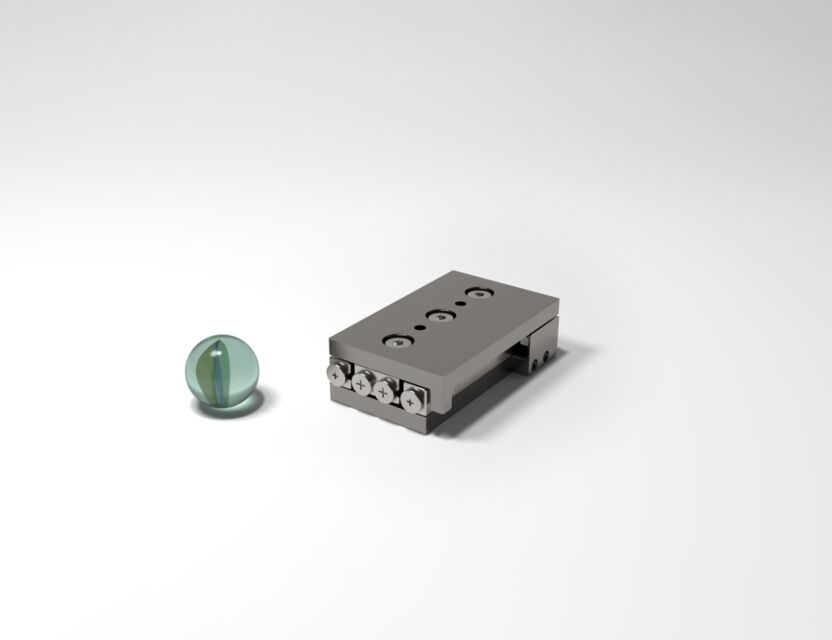 SmarAct SLC-2445 stick-slip positioner with glass marble for scale reference